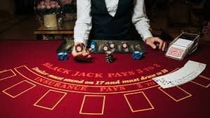 Mobile app interface showing live roulette table, betting board, and real-time chat with dealer